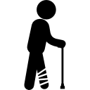Man walking with broken leg with bandage and a cane support 