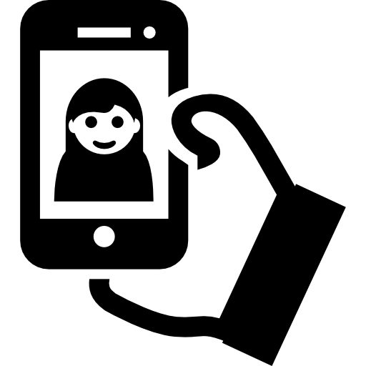 Selfie on phone screen on a hand Free Icon
