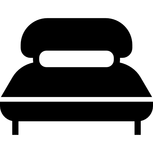 cama grande con almohada larga icono gratis